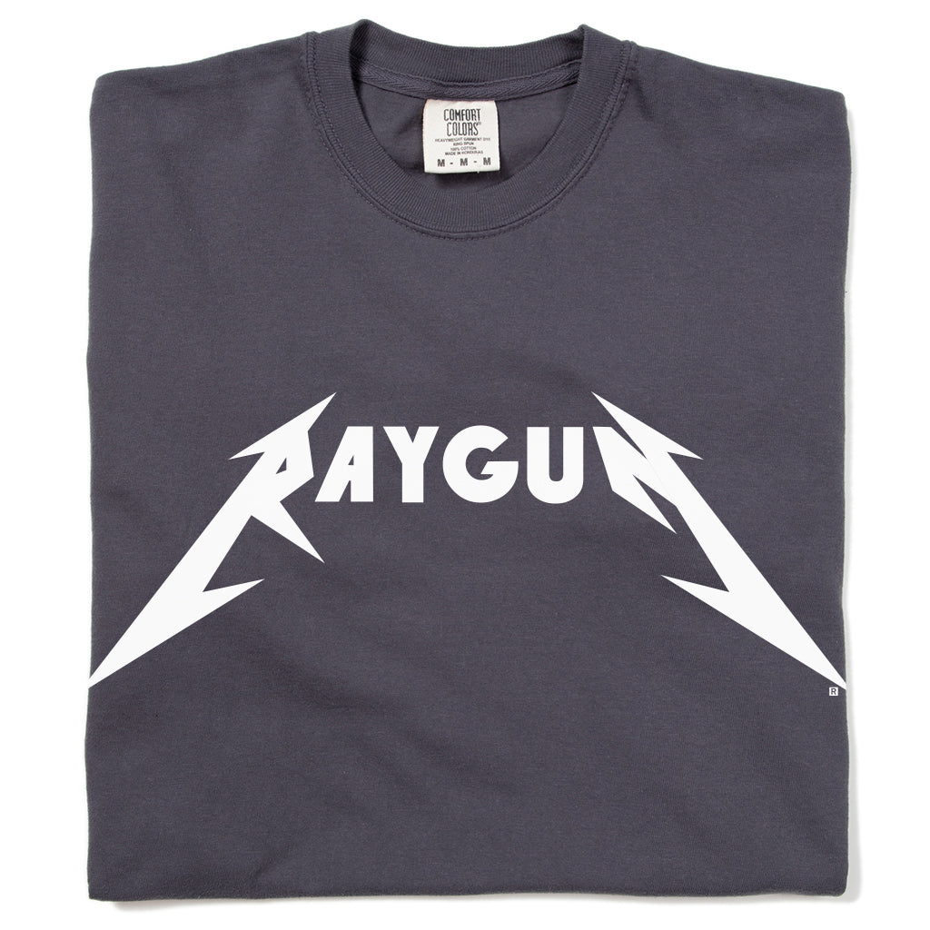 Heavyweight graphite t-shirt with RAYGUN printed in white in a heavy metal-style font.
