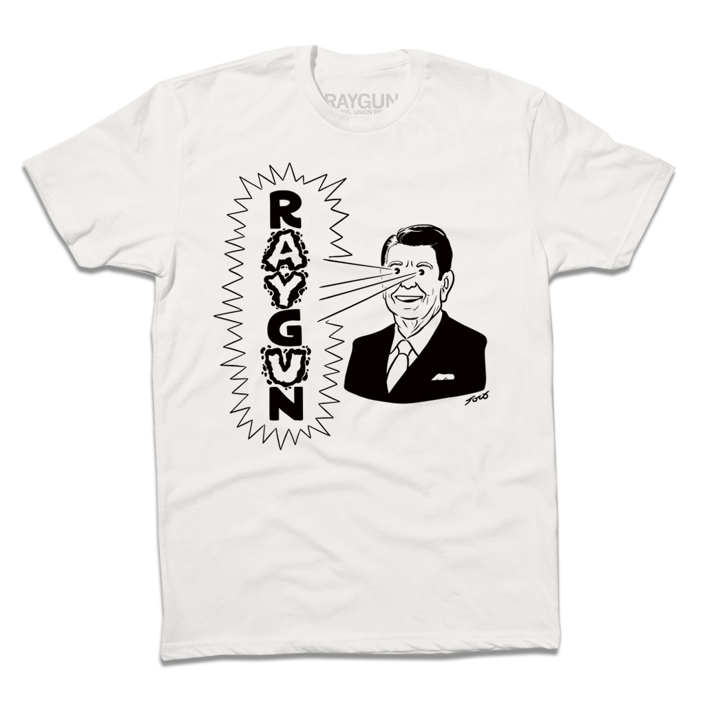 A folded white shirt with blank ink depicting a cartoon Ronald Reagan to the right shooting beams out of his eyes to the left that reads "RAYGUN" in vertical text.