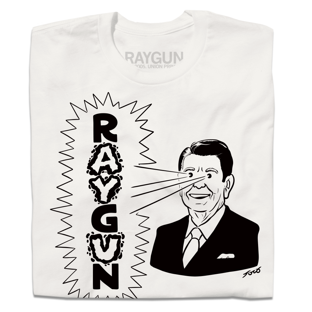 A folded white shirt with blank ink depicting a cartoon Ronald Reagan to the right shooting beams out of his eyes to the left that reads "RAYGUN" in vertical text.