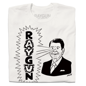 A folded white shirt with blank ink depicting a cartoon Ronald Reagan to the right shooting beams out of his eyes to the left that reads "RAYGUN" in vertical text.