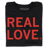 A folded black t-shirt with all-caps red text that says, "REAL LOVE."