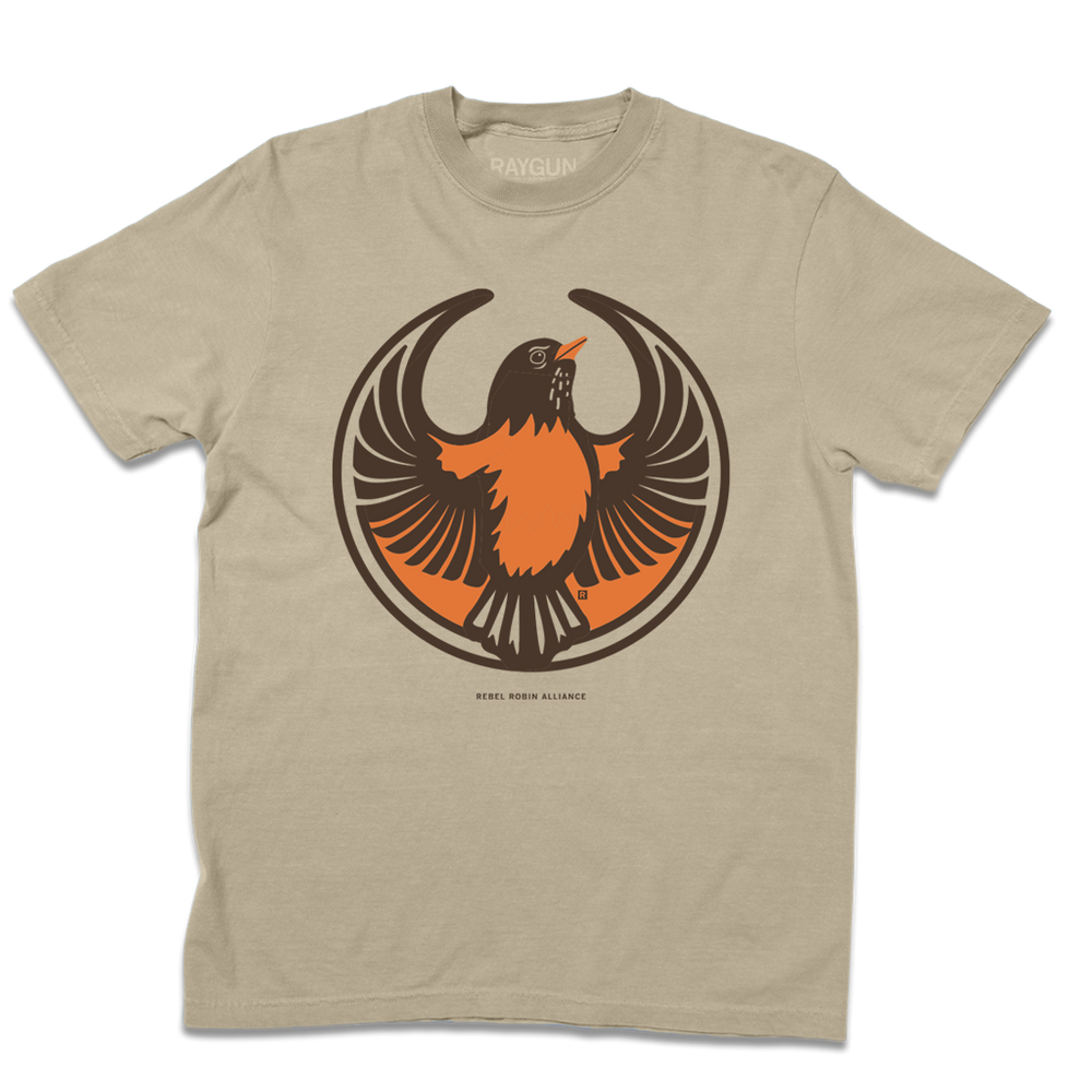 Comfort Colors heavyweight khaki t-shirt with the Rebel American Robin Alliance Logo. It uses a american robin with outstretched wings to mimic the shape of the Star Wars Rebel Alliance Logo. The american robin is printed in orange and brown ink.