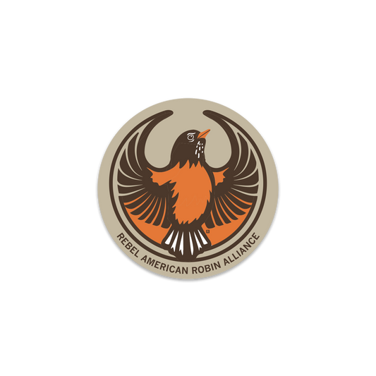 Circular logo featuring an American robin with wings spread and the text REBEL AMERICAN ROBIN ALLIANCE along the bottom edge, as seen on this RAYGUN Rebel American Robin sticker.