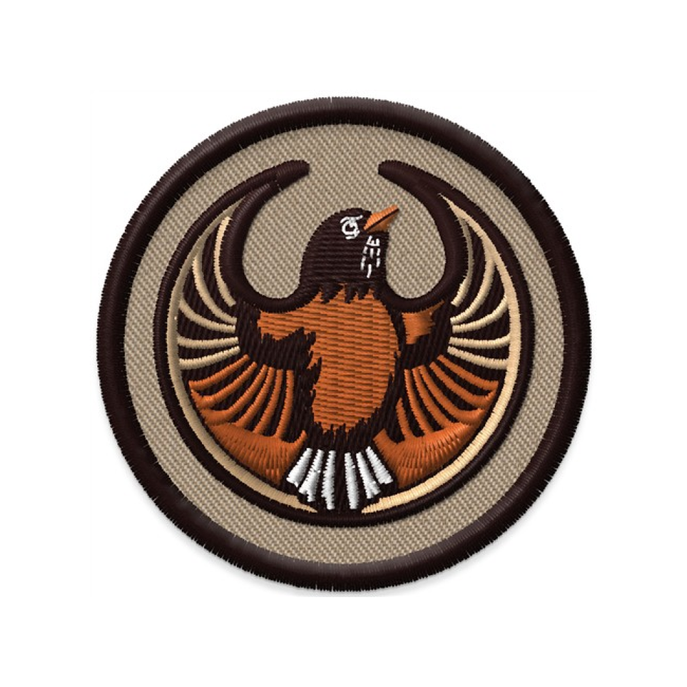 A embroidered circle patch with the Rebel American Robin Alliance Logo. It uses a American robin with outstretched wings to mimic the shape of the Star Wars Rebel Alliance Logo. The American robin is orange, brown, and white. The border of the patch is brown and the rest of it is tan.