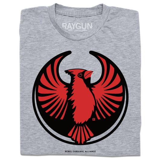 A folded heather grey t-shirt with the Rebel Northern Cardinal Alliance Logo. It uses a northern cardinal with outstretched wings to mimic the shape of the Star Wars Rebel Alliance Logo. The northern cardinal is printed in red and black ink.