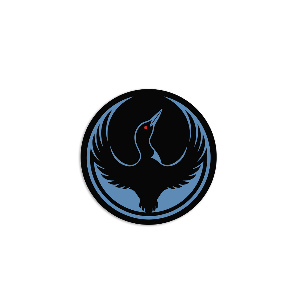 A circular black sticker with the Rebel Loon Alliance Logo. It uses a loon with outstretched wings to mimic the shape of the Star Wars Rebel Alliance Logo. The loon is printed blue & black with red eye.