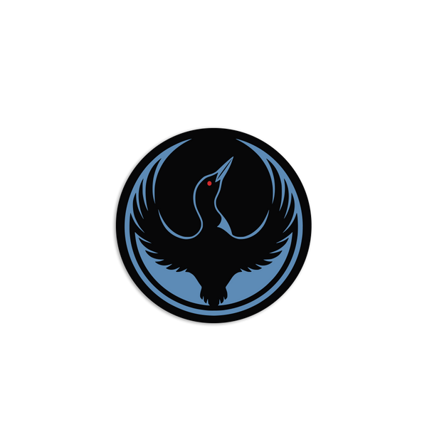 A circular black sticker with the Rebel Loon Alliance Logo. It uses a loon with outstretched wings to mimic the shape of the Star Wars Rebel Alliance Logo. The loon is printed blue & black with red eye.