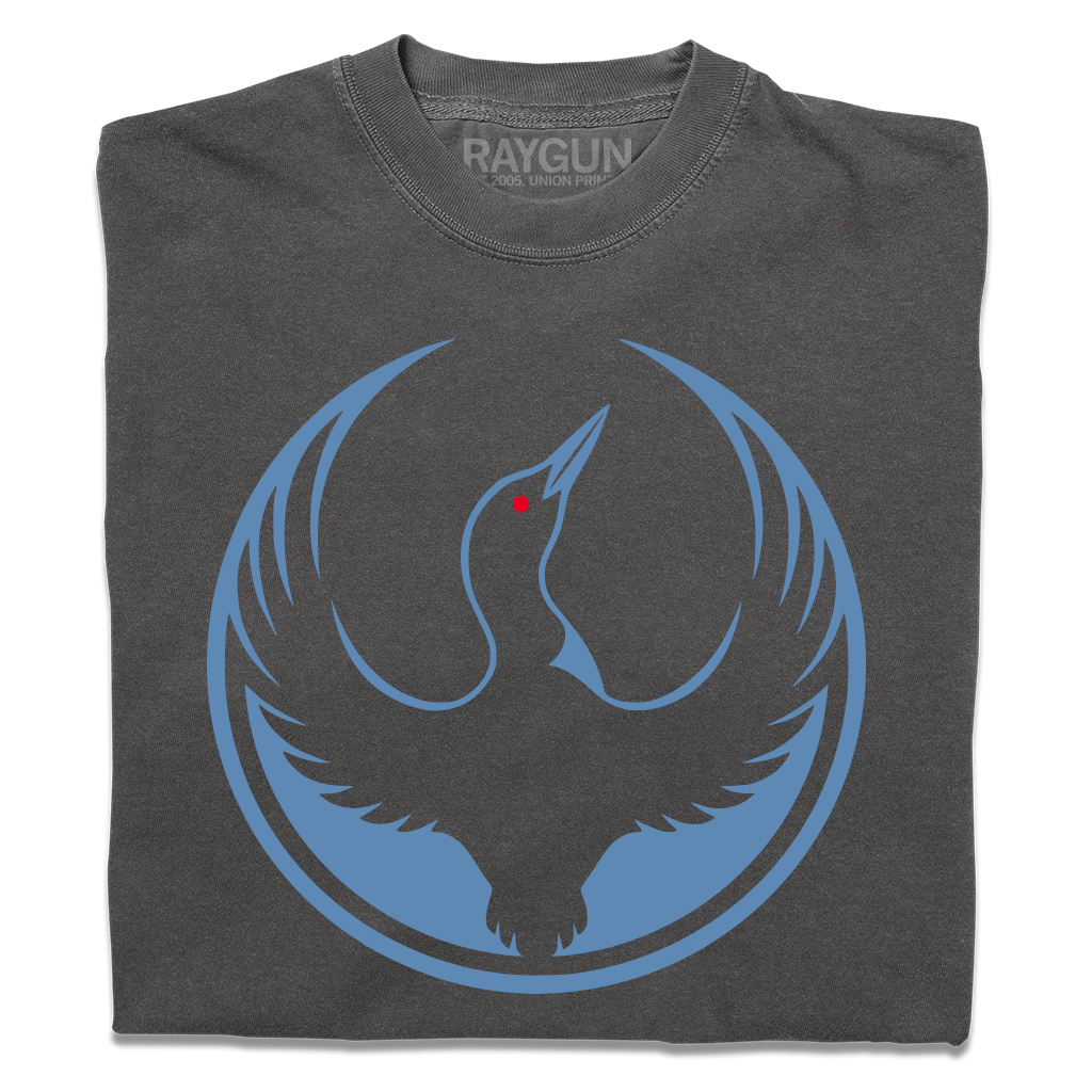 A folded heavyweight charcoal shirt with the Rebel Loon Alliance Logo. It uses a loon with outstretched wings to mimic the shape of the Star Wars Rebel Alliance Logo. The loon is printed blue & black with red eye.