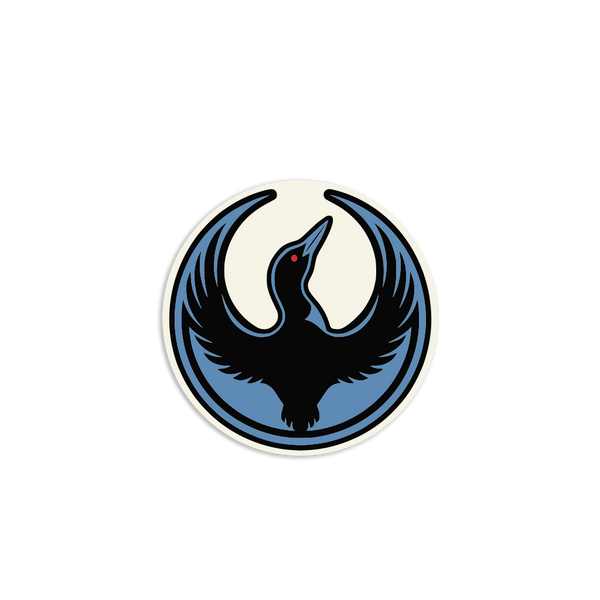 A circular white sticker with the Rebel Loon Alliance Logo. It uses a loon with outstretched wings to mimic the shape of the Star Wars Rebel Alliance Logo. The loon is printed blue & black with red eye.