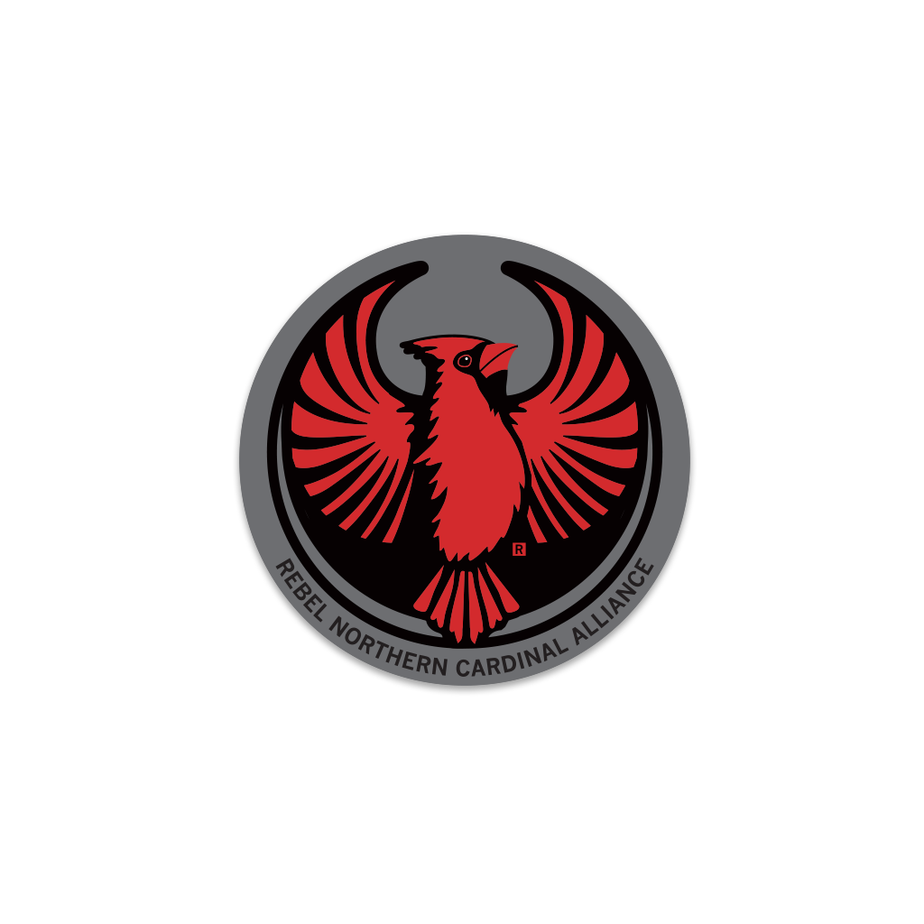 Circular Rebel Northern Cardinal emblem featuring a stylized red cardinal with spread wings and the text REBEL NORTHERN CARDINAL ALLIANCE along the bottom edge, in the style of a RAYGUN vinyl sticker.