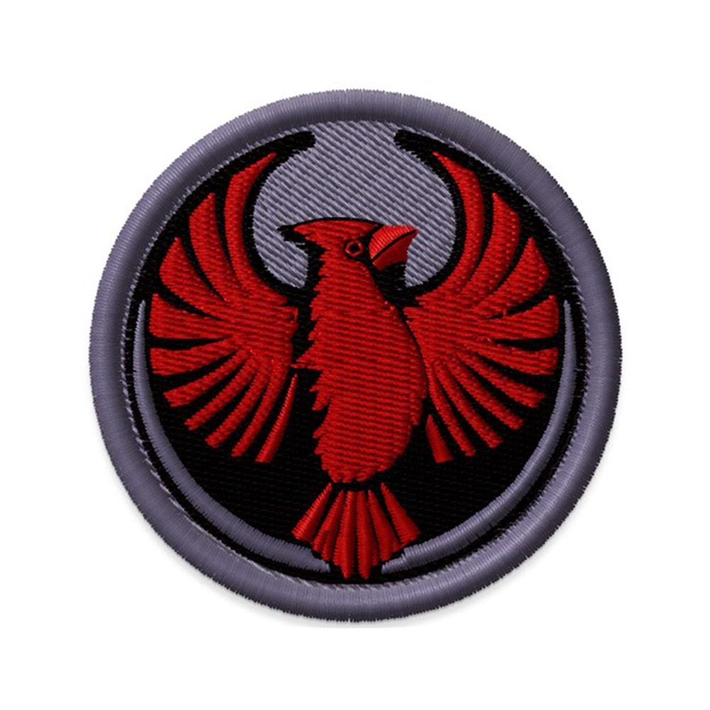 Circular embroidered patch with the Rebel Northern Cardinal Alliance Logo. It uses a northern cardinal with outstretched wings to mimic the shape of the Star Wars Rebel Alliance Logo. The northern cardinal is black and red while the rest of the patch is grey.