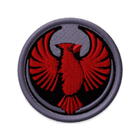 Circular embroidered patch with the Rebel Northern Cardinal Alliance Logo. It uses a northern cardinal with outstretched wings to mimic the shape of the Star Wars Rebel Alliance Logo. The northern cardinal is black and red while the rest of the patch is grey.