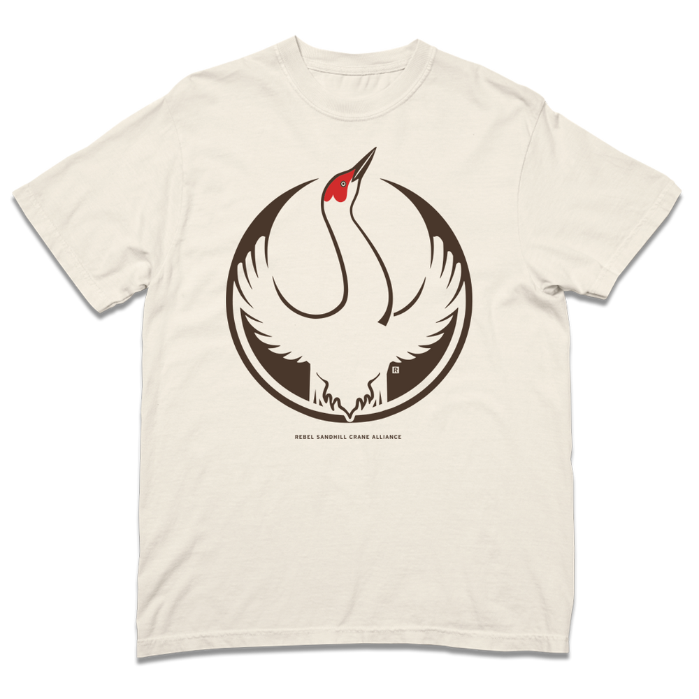 Comfort Colors heavyweight ivory t-shirt with the Rebel Sandhill Crane Alliance Logo. It uses a rebel sandhill crane with outstretched wings to mimic the shape of the Star Wars Rebel Alliance Logo. The bird is printed in red and brown ink.