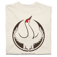 A folded heavyweight ivorytshirt with the Rebel Sandhill Crane Alliance Logo. It uses a rebel sandhill crane with outstretched wings to mimic the shape of the Star Wars Rebel Alliance Logo. The bird is printed in red and brown ink.