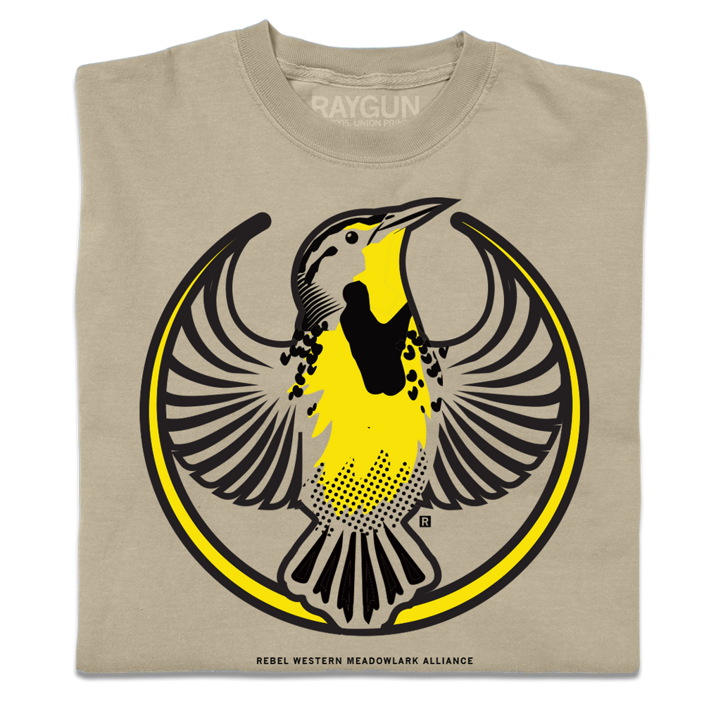 A folded heavyweight khaki shirt with the Rebel Western Meadowlark Alliance Logo. It uses a western meadowlark with outstretched wings to mimic the shape of the Star Wars Rebel Alliance Logo. The western meadowlark is printed in black and gold ink.