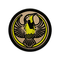 An embroidered circle patch with the Rebel Western Meadowlark Alliance Logo. It uses a western meadowlark with outstretched wings to mimic the shape of the Star Wars Rebel Alliance Logo. The western meadowlark is black and gold. The border of the patch is black and the rest of it is tan.