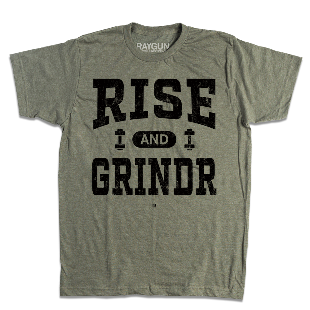 A heather military green t-shirt with black ink styled like a gym shirt with faded text that reads "Rise and Grindr" with dumbbells on either side of "and."