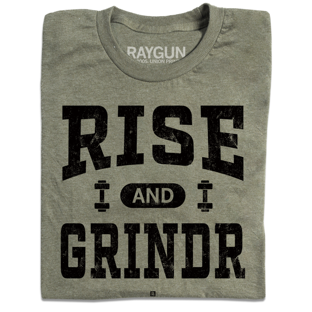 A folded heather military green t-shirt with black ink styled like a gym shirt with faded text that reads "Rise and Grindr"