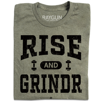 A folded heather military green t-shirt with black ink styled like a gym shirt with faded text that reads "Rise and Grindr"