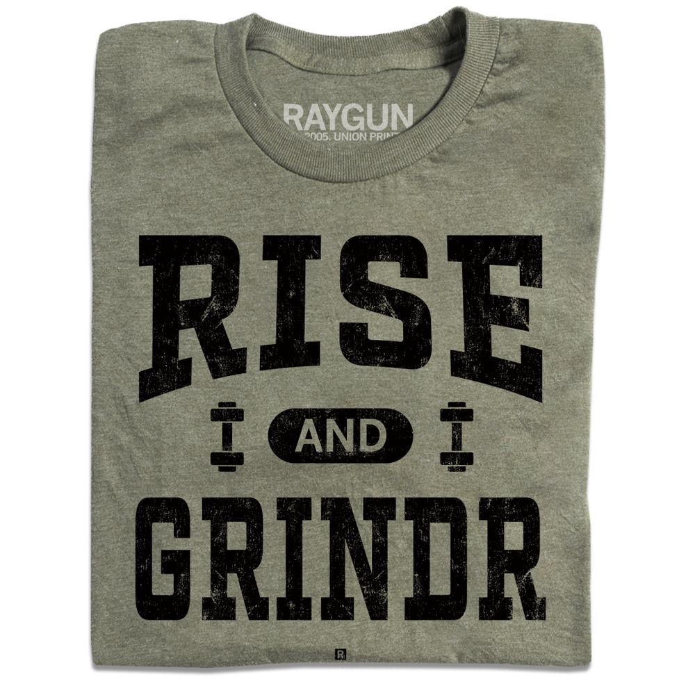 A folded heather military green t-shirt with black ink styled like a gym shirt with faded text that reads "Rise and Grindr"