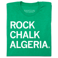 A folded heather green t-shirt with left-aligned white ink that reads "Rock Chalk Algeria"