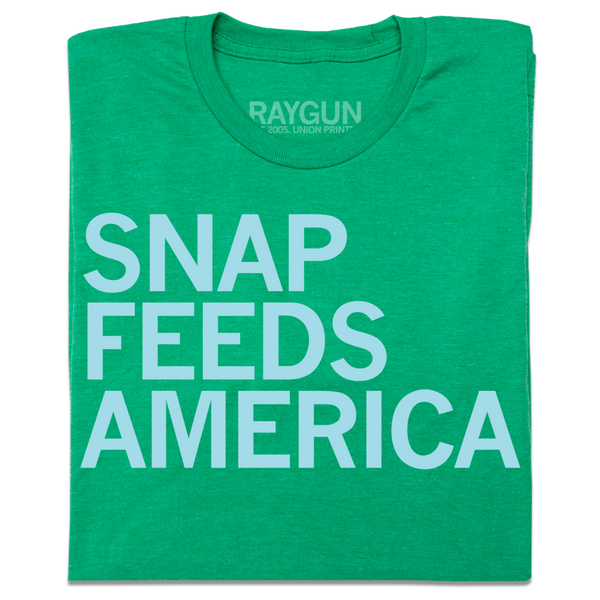 A folded Heather Kelly Green shirt with ice blue text that reads 