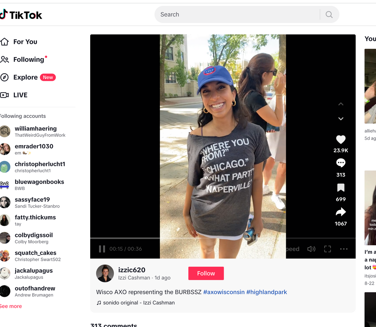 A woman wearing a blue baseball cap and a union made Chicago t-shirt that says Where you from? Chicago. What part? Naperville poses outdoors.