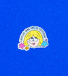 A glittery vinyl sticker of a blonde cartoon character with the text Abortion bans are so yesterday surrounded by colorful flowers against a blue background.