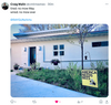 A yard with a wild-grown lawn and a made in USA sign that reads AMERICA NEEDS BEES with an illustration of a bee.