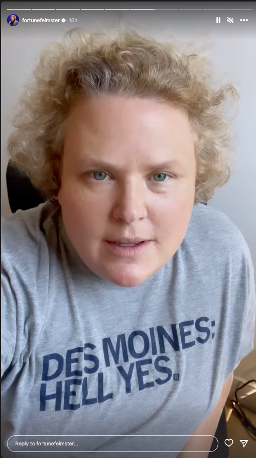 Fortune Feimster wearing a heather grey T-shirt that says Des Moines: Hell Yes.