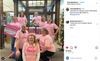 Eight librarians in union-made, pink My job is books t-shirts pose for a photo in a library, holding breast cancer awareness signs.