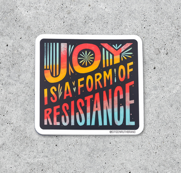 A square Citizen Ruth vinyl sticker featuring the phrase JOY IS A FORM OF RESISTANCE in colorful, stylized lettering against a dark background.