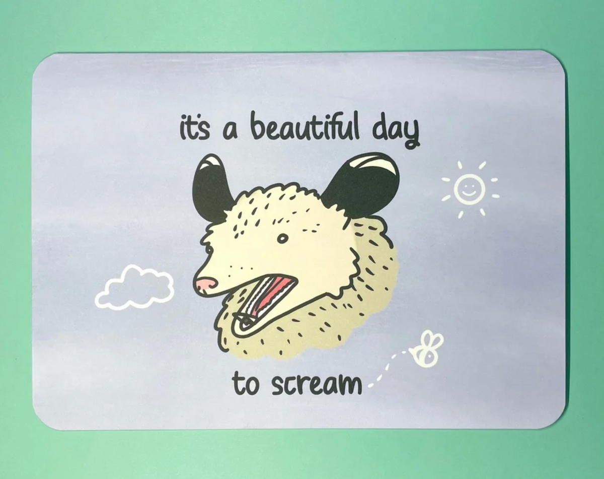 An inkjet illustration on a card featuring a drawing of a screaming opossum with the text, it’s a beautiful day to scream.