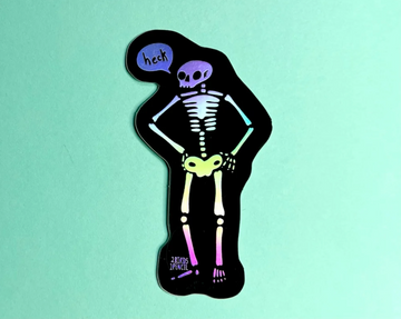 A holographic skeleton sticker standing with hands on hips and a speech bubble that says heck.