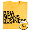 A folded heather yellow t-shirt with left-aligned black text that says, "BRIA MEANS BUSINESS" with smaller text below that reads "BRIA MEDINA." A circle image to the bottom right shows the back of the shirt printed like a jersey with "MEDINA" over 50.