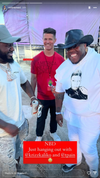 Three men standing outdoors, including T-Pain on the right in a white hoodie and black cowboy hat, with America Needs Love written in red text at the bottom.