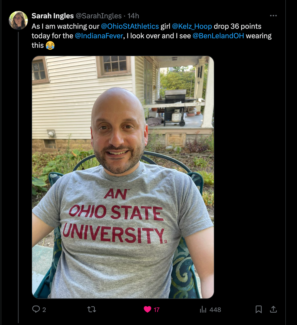 A smiling man wearing a heather grey Ohio State University t-shirt.