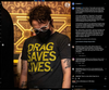 A person wearing glasses and a black face mask, dressed in a charcoal T-shirt that reads DRAG SAVES LIVES.