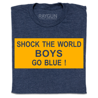 A folded heather navy t-shirt with a gold ink rectangle printed around the text "Shock the world
boys
Go blue!"