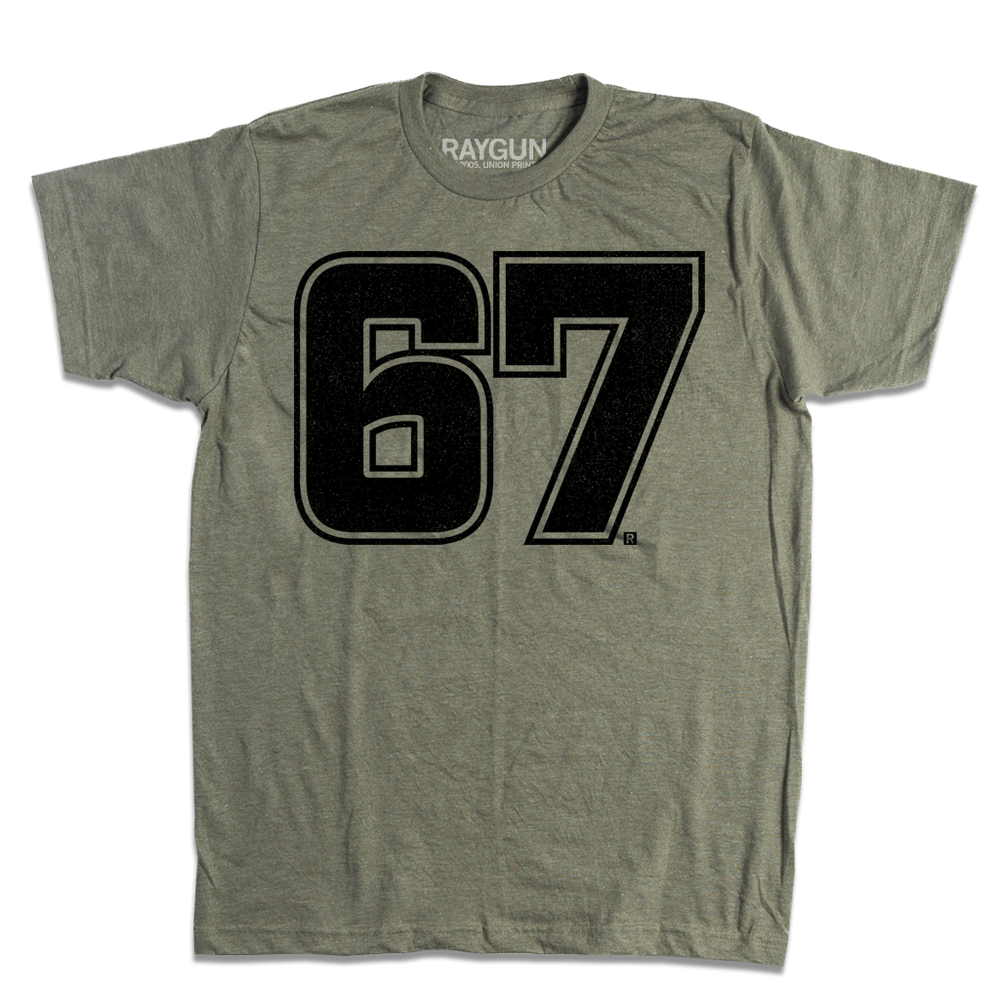 A heather military green t-shirt with giant "67" printed in black ink in the center.