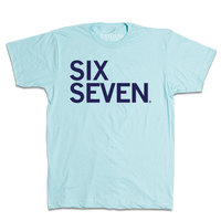 A heather light blue shirt with navy left-aligned text that says, "Six Seven"