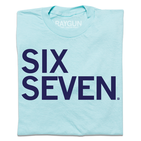 Light blue t-shirt with navy left-aligned text that says, "Six Seven"