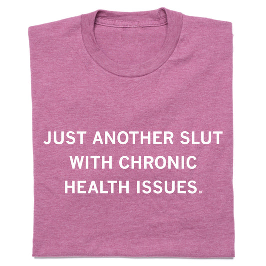 A heather cassis t-shirt with the white text, JUST ANOTHER SLUT WITH CHRONIC HEALTH ISSUES.