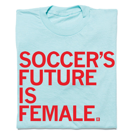 Light blue RAYGUN t-shirt featuring the red text SOCCERS FUTURE IS FEMALE.