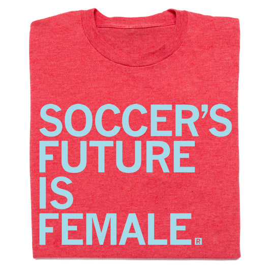 Red soccer t-shirt with the text SOCCERS FUTURE IS FEMALE in light blue letters.