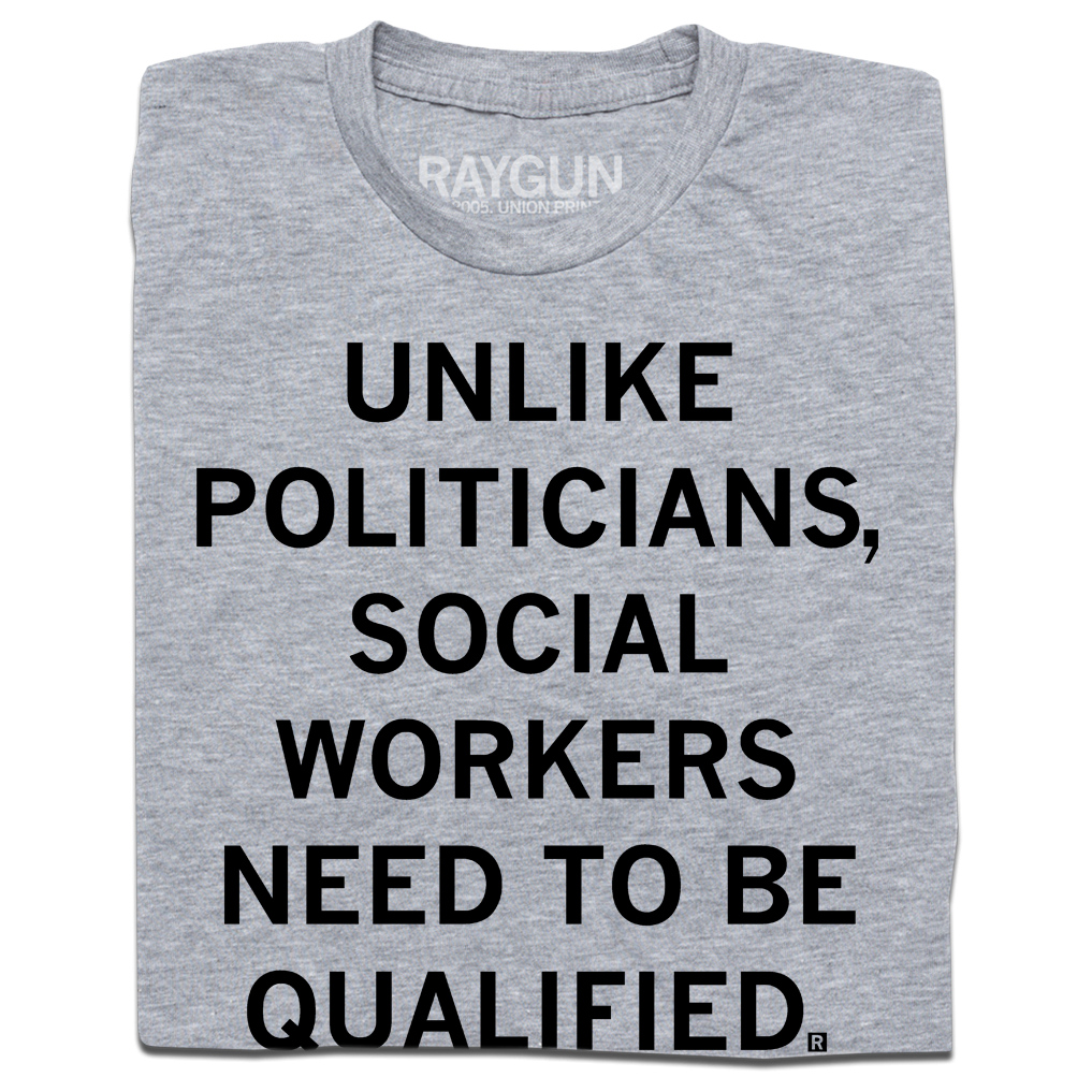 Folded heather grey t-shirt with black text that says, "Unlike politicians, social workers need to be qualified."