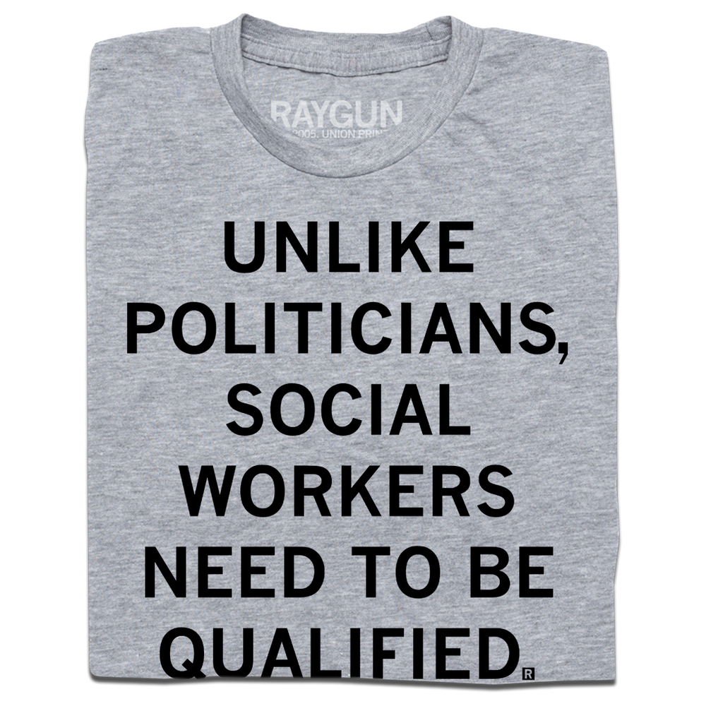 Folded heather grey t-shirt with black text that says, "Unlike politicians, social workers need to be qualified."