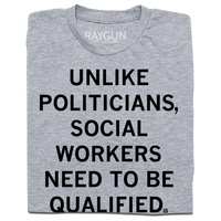 Folded heather grey t-shirt with black text that says, "Unlike politicians, social workers need to be qualified."