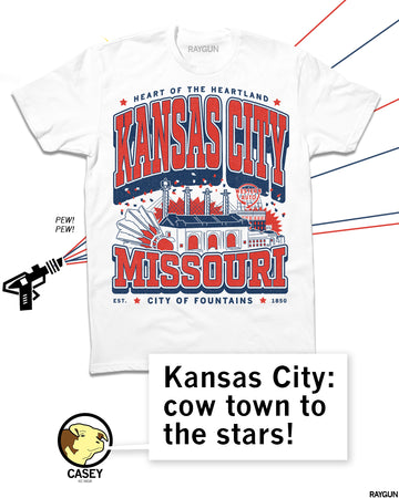 RAYGUN shirt image with Kansas City Missouri max design, red and blue on white. RAYGUN blasting in the background. RAYGUN character Casey the cow saying "Kansas City: cow town to the stars!" 