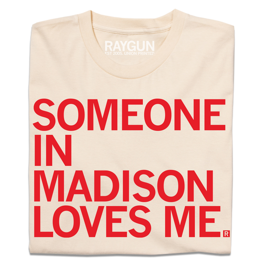 Cream-colored, union made t-shirt with the red text SOMEONE IN MADISON LOVES ME. printed on the front.